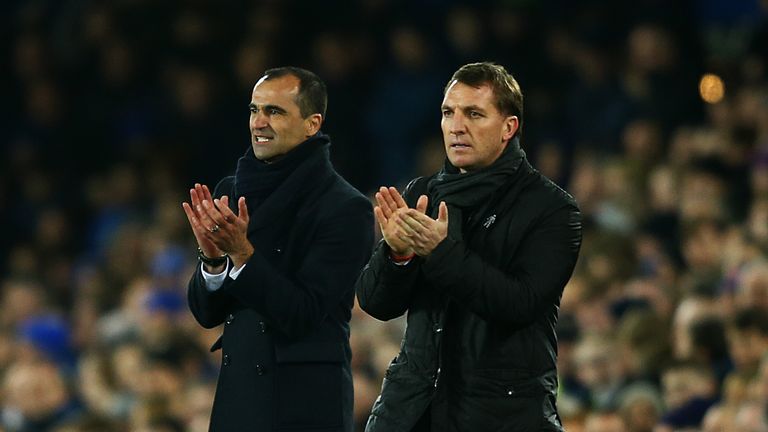 Liverpool manager Brendan Rodgers and Everton boss Roberto Martinez applaud their respective players