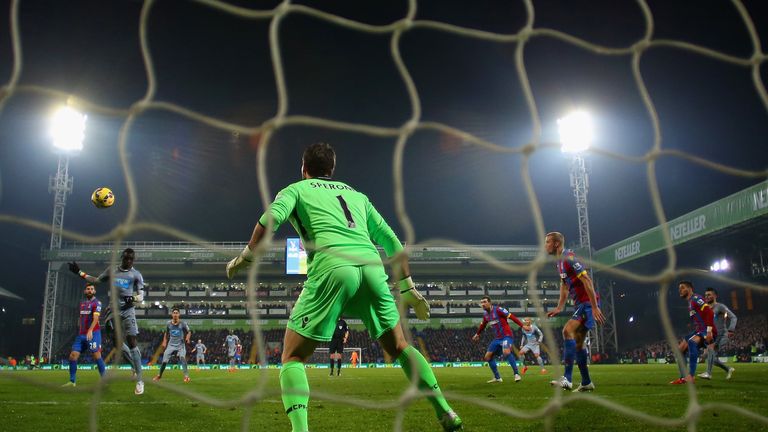 Newcastle's Papiss Demba Cisse heads past Julian Speroni of Crystal Palace to put the Magpies 1-0 up at Selhurst Park