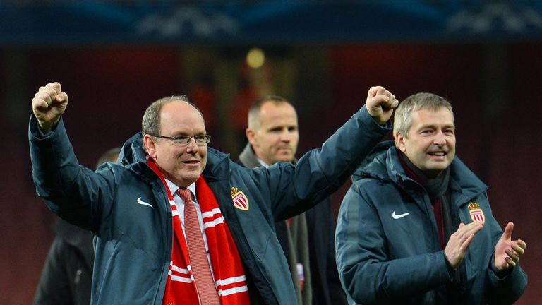 Prince Albert II celebrates after the final whistle of the UEFA Champions League round of 16 first leg football match between Arsenal and Monaco