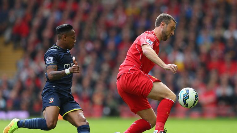 Rickie Lambert of Liverpool turns away from Nathaniel Clyne of Southampton during the Premier League match at Anfield