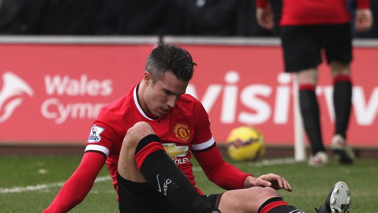 Robin van Persie of Manchester United lies injured