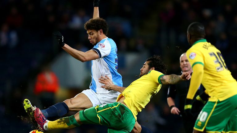 BLACKBURN, ENGLAND - FEBRUARY 24: Rudy Gestede of Blackburn Rovers in action with Bradley Johnson of Norwich City during the Sky Bet Championship match bet