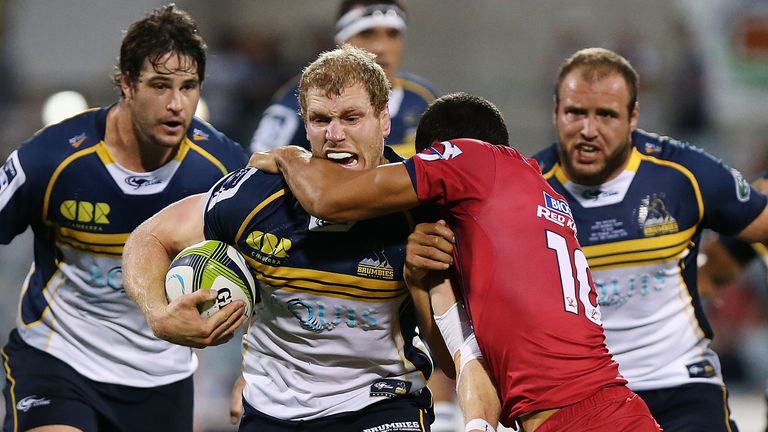 David Pocock Brumbies tackled by Quade Cooper Queensland Reds