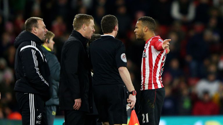 Ryan Bertrand of Southampton squares up to Garry Monk the manager of Swansea City