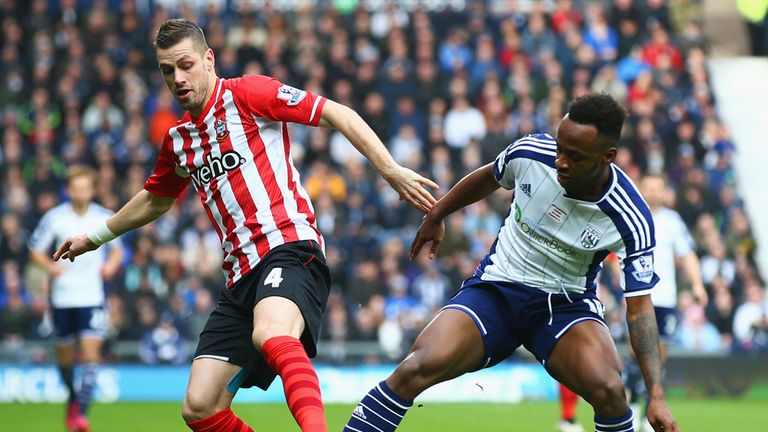 Saido Berahino is tackled by Morgan Schneiderlin 