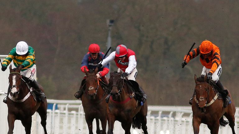 ASCOT, ENGLAND - FEBRUARY 14: Ruby Walsh produces Thistlecrack (R) to win The Racing UK Profits Returned To Racing Novices' Hurdle.