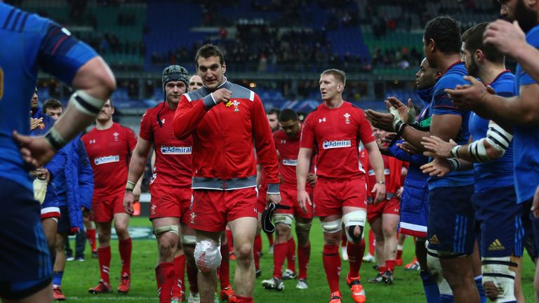 Sam Warburton accepts the applause from the French players as he hobbles off after his sides 20-13 win