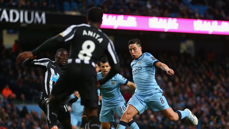 Samir Nasri scores Manchester City's second goal against Newcastle United at the Etihad Stadium