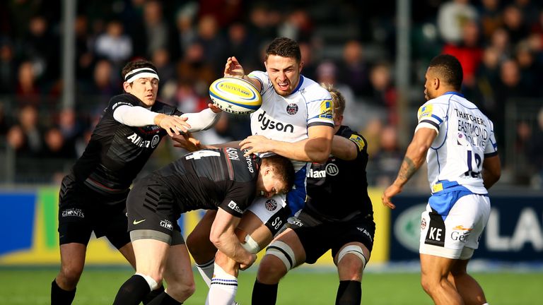 Sam Burgess of Bath is tackled by Chris Ashton of Saracens during the Aviva Premiership match between Saracens and Bath Rugby at Allianz Park