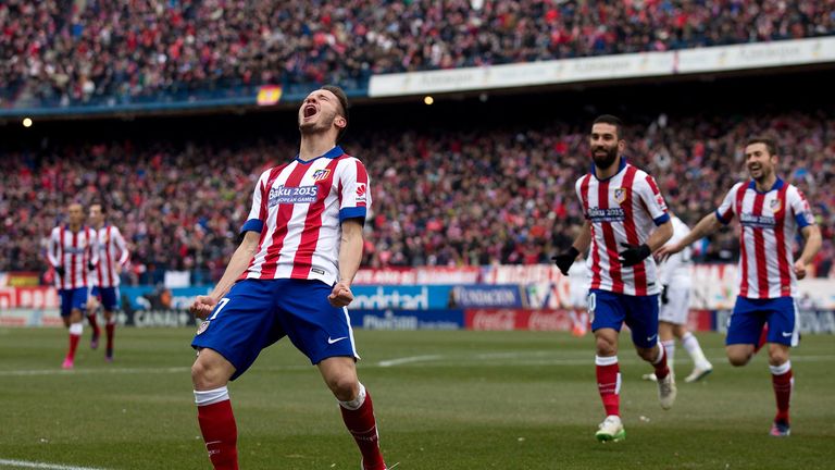 Saul Niguez celebrates scoring Atletico's second goal during their 4-0 win over Real.