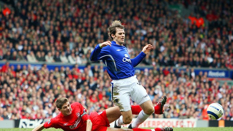 Liverpool's Steven Gerrard (L) tackles Everton's Kevin Kilbane (R) during their English Premiership football match at Anfield in March 2006