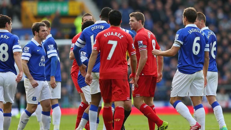 The Everton players react to Steven Gerrard of Liverpool following a challenge on Gareth Barry of Everton during the November 2013 derby