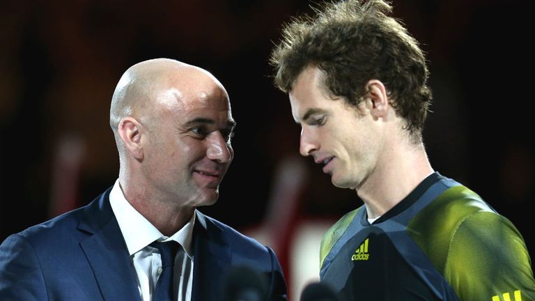 Andre Agassi speaks to Andy Murray after losing his men's final match against Novak Djokovic 