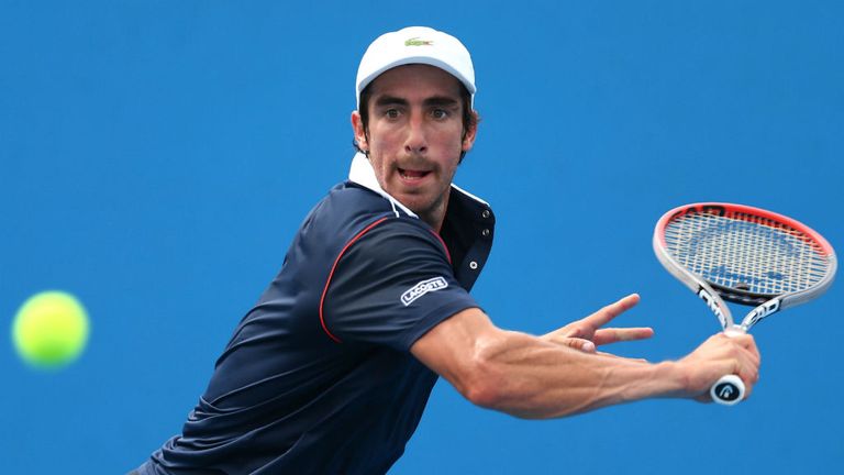Pablo Cuevas plays a backhand in his first round match against Matthias Bachinger during the 2015 Australian Open