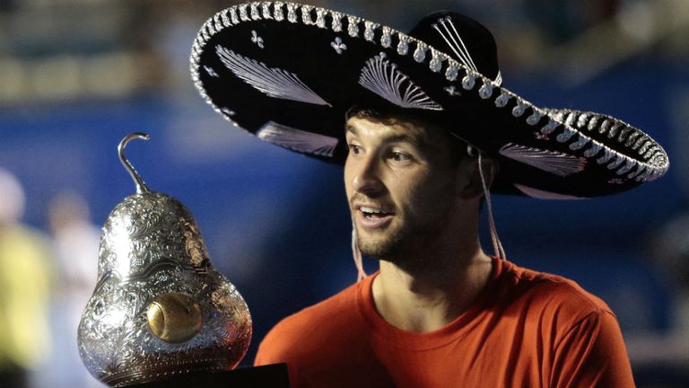 Grigor Drimitrov wears a traditional Mexican mariachi hat and winning trophy at the Mexico ATP Open 