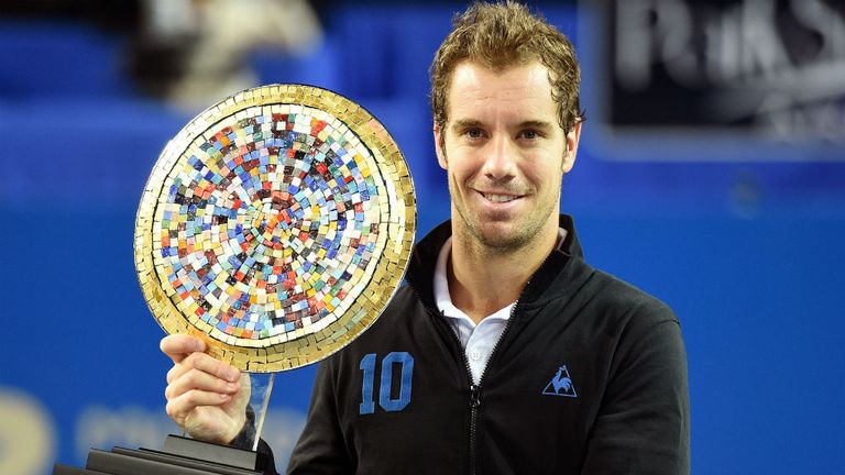 Richard Gasquet poses with his trophy after beating Jerzy Janowicz in the final of the Open Sud de France ATP Series