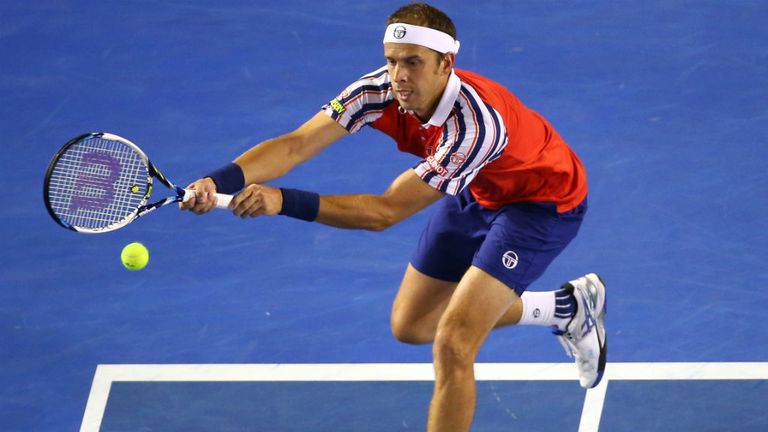 Gilles Muller plays a backhand in his fourth round match against Novak Djokovic  at the 2015 Australian Open