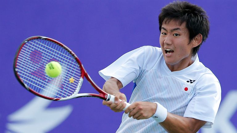 Yoshihito Nishioka returns a shot to Lu Yen Hsun during the Men's Singles Gold Medal Match
