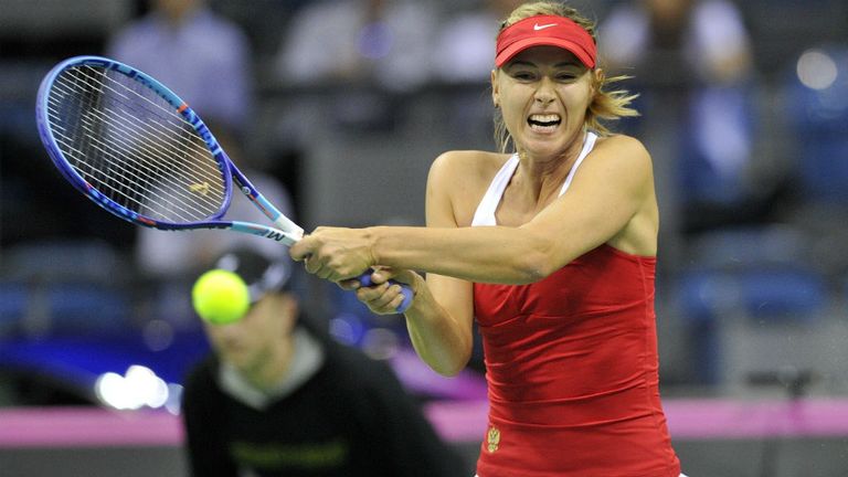 Maria Sharapova returns the ball during their Fed Cup World Group match between Poland and Russia in Krakow