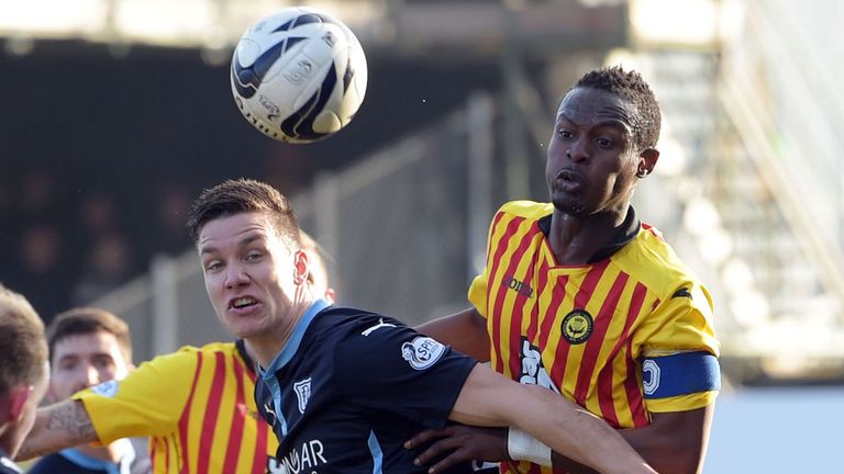 Thomas Konrad (Dundee) battles for the ball with Abdul Osman (Partick)