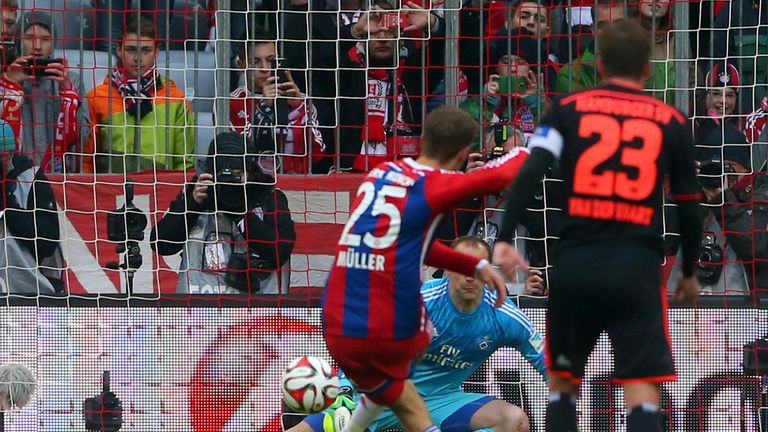 MUNICH, GERMANY - FEBRUARY 14:  Thomas Mueller of Muenchen scores the opening goal with a penalty  against 