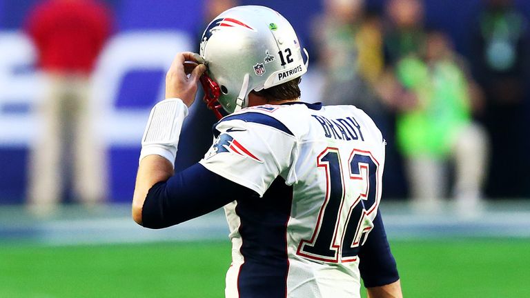 GLENDALE, AZ - FEBRUARY 01:   Tom Brady #12 of the New England Patriots walks off the field after throwing an interception against the Seattle Seahawks in 