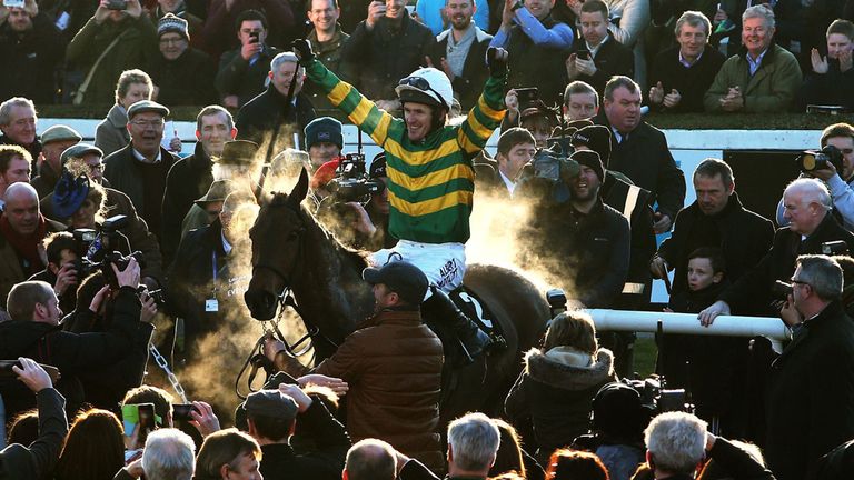 Tony McCoy enters the parade ring aboard Carlingford Lough after winning the Hennessy Gold Cup