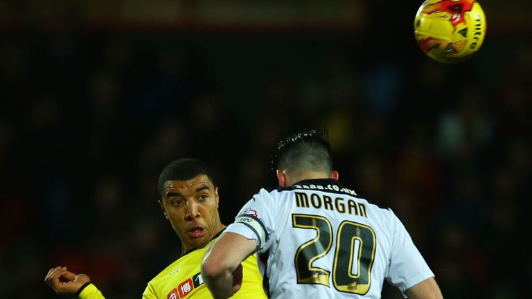 WATFORD, ENGLAND - FEBRUARY 24:  Troy Deeney of Watford and Craig Morgan of Rotherham United battle for the ball during the Sky Bet Championship match betw