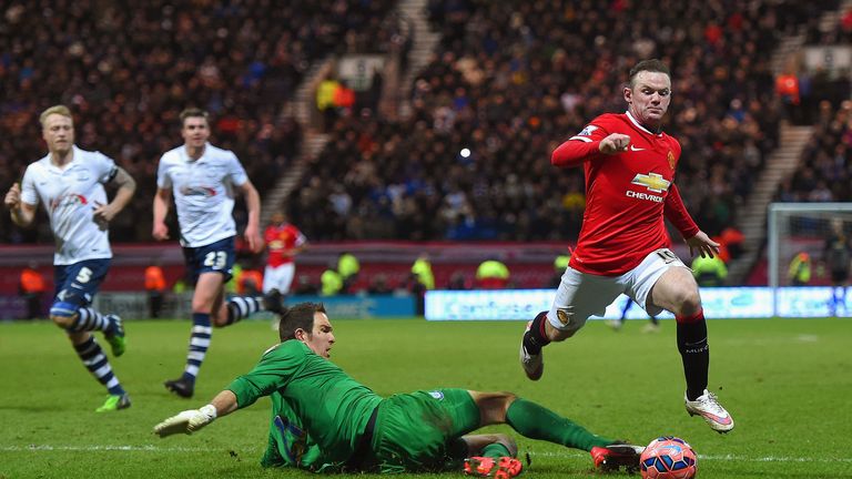 Wayne Rooney of Manchester United draws a foul from Thorsten Stuckmann of Preston North End to win a penalty during the FA Cup Fifth round match