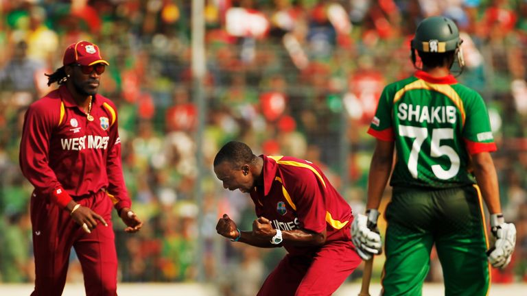 DHAKA, BANGLADESH - MARCH 04: Kemar Roach of West Indies celebrates the wicket of Zunaed Siddique during the 2011 ICC World Cup Group B match between Bangl