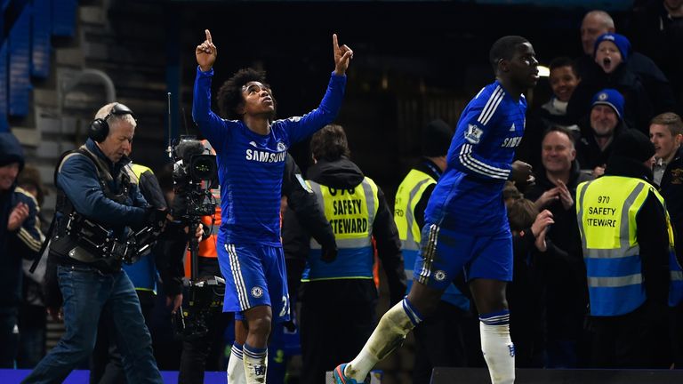 Willian of Chelsea (L) celebrates scoring