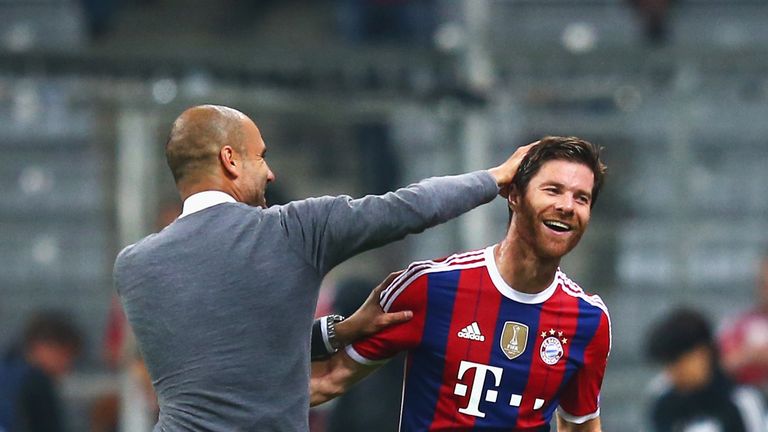 Pep Guardiola and Xabi Alonso during the UEFA Champions League Group E match between Bayern Munchen and Manchester City at the Allianz Arena