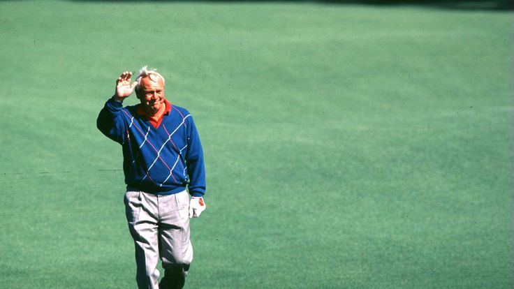 Arnold Palmer of USA waves to the crowd during practice at the Masters golf tournament at the Augusta National Golf Club.