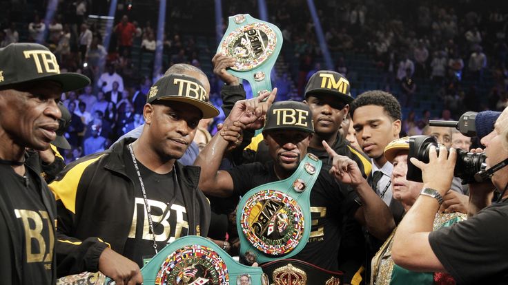 Floyd Mayweather Jr. of the US poses with his belts after beating Marcos Maidana of Argentina on September 13, 2014 at The MGM Grand, Las Vegas. Mayweather