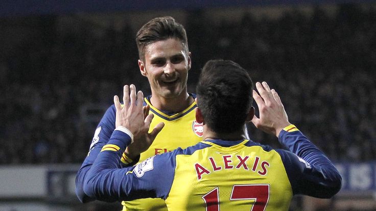 Olivier Giroud and Alexis Sanchez celebrate during Arsenal's 2-1 win at Queens Park Rangers, March 2015