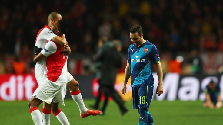 Santi Cazorla of Arsenal looks dejected as Monaco players celebrate