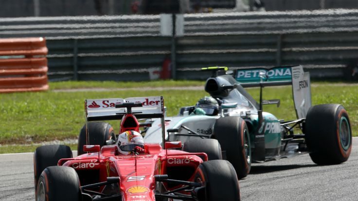 Sebastian Vettel leads Nico Rosberg, 2015 Malaysia GP