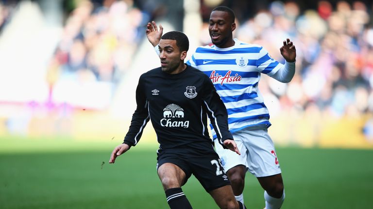 Aaron Lennon of Everton goes past Junior Hoilett of QPR during the Barclays Premier League match between Queens Park Rangers and