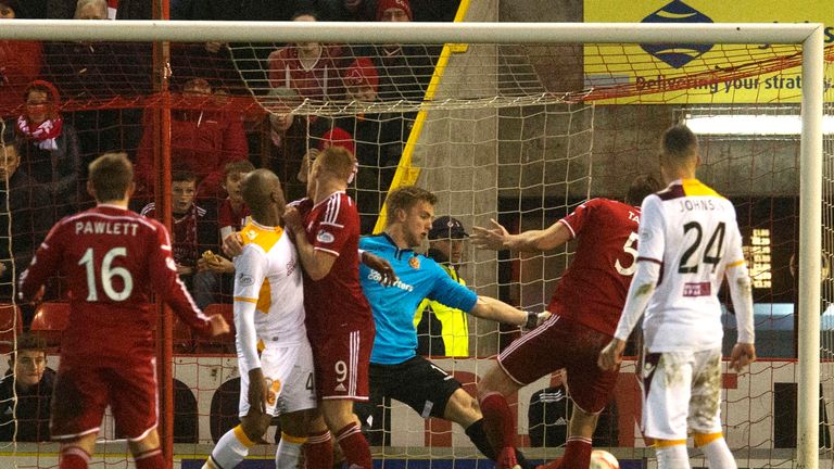 Ash Taylor heads the ball towards goal for the equaliser