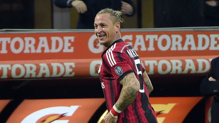 AC Milan's defender Philippe Mexes celebrates after scoring