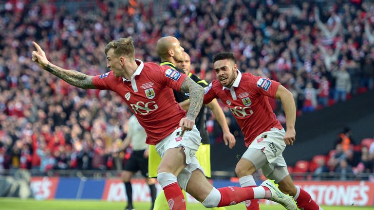 Bristol City's Aden Flint celebrates scoring the first goal during the Johnstone's Paint Trophy Final at Wembley