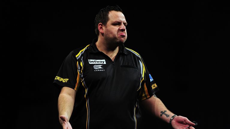 Adrian Lewis of England celebrates after winning a leg against Stephen Bunting of England during The Betway Premier League Darts