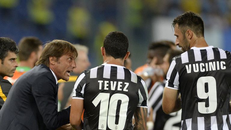 Head coach FC Juventus Antonio Conte, Carlos Tevez and Mirko Vucinic during the TIM Supercup match against Lazio in August 2013