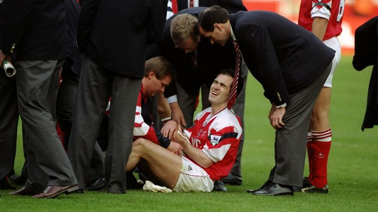 1993:  Steve Morrow of Arsenal sits in pain after being dropped by team mate Tony Adams during the celebrations after the Coca Cola Cup final against Sheff