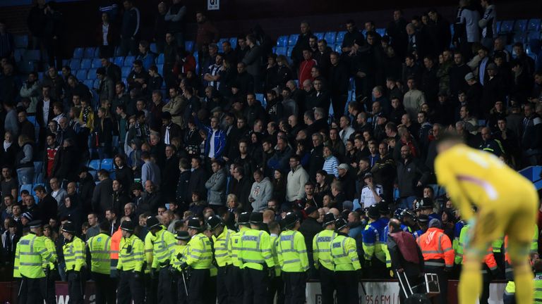 Police stand in front of the West Bromwich Albion fans during the FA Cup Sixth Round match at Villa Park, Birmingham.