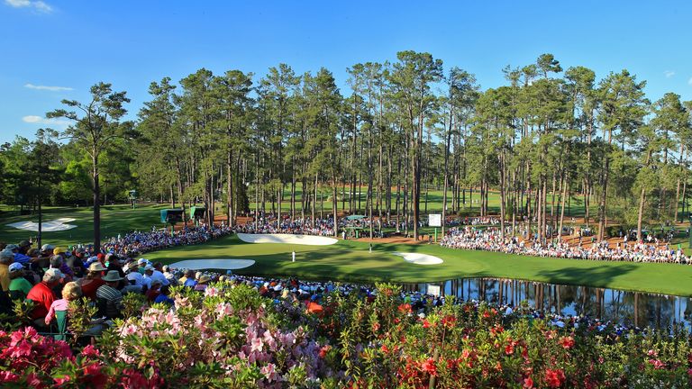 Fans watch the play on the 16th hole during the third round of the 2014 Masters Tournament at Augusta National Golf Club.