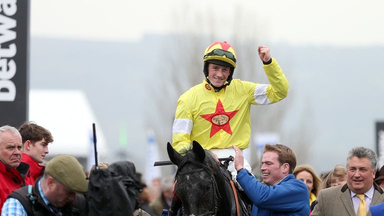 Jockey Sam Twiston-Davies celebrates on Aux Ptits Soins after victory in the Coral Cup on Ladies Day during the Cheltenham Festival.