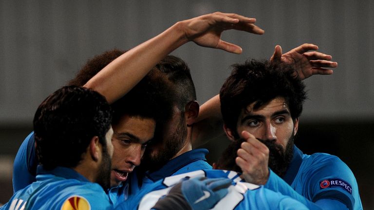Zenit's midfielder Axel Witsel lebrates with teammates after scoring a goal during the UEFA Europa League round of 16 football match between FC Zenit and 