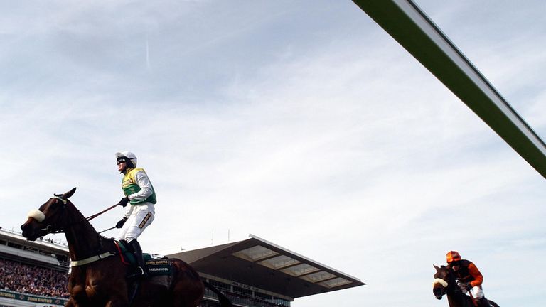 Ballabriggs ridden by Jason Maguire wins the 2011 John Smith's Grand National from Oscar Time ridden by Sam Waley-Cohen .