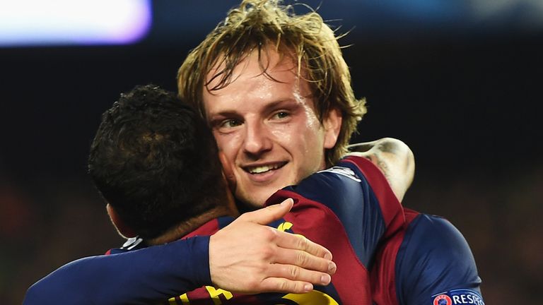  Ivan Rakitic of Barcelona (R) celebrates scoring the opening goal with Daniel Alves of Barcelona